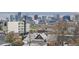 Scenic city view showcasing the Denver skyline with an overlook of neighboring residential architecture at 3444 Navajo St # 10, Denver, CO 80211