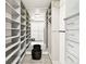 Well-organized walk-in closet with ample shelving, drawers, and hanging space at 3444 Navajo St # 10, Denver, CO 80211