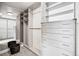 Spacious walk-in closet features custom shelving and drawers for optimal organization and storage at 3444 Navajo St # 10, Denver, CO 80211