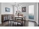 Bright dining room with modern chandelier, stylish furniture, and contemporary artwork at 3444 Navajo St # 10, Denver, CO 80211