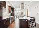 Well-lit kitchen featuring an island with seating, modern appliances, and sleek cabinets at 3444 Navajo St # 10, Denver, CO 80211