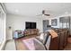 Spacious living room with hardwood floors, a sectional sofa, and a large entertainment unit at 3444 Navajo St # 10, Denver, CO 80211