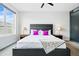 Main bedroom with contemporary design elements, including a plush bed and modern decor at 3444 Navajo St # 10, Denver, CO 80211