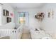Cozy bedroom with two beds, whimsical decor, and natural light from a window at 26095 Columbine Trl, Kittredge, CO 80457