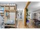 Inviting entryway with built-in storage, bench seating, and convenient access to the kitchen at 26095 Columbine Trl, Kittredge, CO 80457