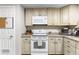 Well-maintained kitchen features white appliances, and granite countertops at 26095 Columbine Trl, Kittredge, CO 80457