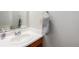 Clean bathroom with single sink vanity, mirror, and toilet at 1711 S Blackhawk Way # D, Aurora, CO 80012