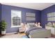 Bright bedroom with double bed, window, and stylish decor at 1711 S Blackhawk Way # D, Aurora, CO 80012