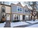 Three-unit townhome building with snow-covered walkway at 1711 S Blackhawk Way # D, Aurora, CO 80012