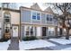 Three-unit townhome building with gray siding and landscaping at 1711 S Blackhawk Way # D, Aurora, CO 80012