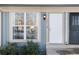 White front door with sidelights and black security door at 1711 S Blackhawk Way # D, Aurora, CO 80012