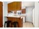 Kitchenette with wood cabinets and small appliances at 1711 S Blackhawk Way # D, Aurora, CO 80012