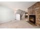 Living room with stone fireplace and carpeted floor at 1711 S Blackhawk Way # D, Aurora, CO 80012