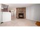 Living room with stone fireplace and carpeted floor at 1711 S Blackhawk Way # D, Aurora, CO 80012