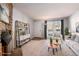 Living room with stone fireplace and staged furniture at 1711 S Blackhawk Way # D, Aurora, CO 80012