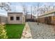 Landscaped backyard featuring a stone path, grass and gravel areas at 3445 N Clay St, Denver, CO 80211