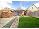 Beautifully landscaped backyard with a charming outdoor dining area at 3445 N Clay St, Denver, CO 80211