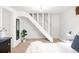Cozy basement bedroom featuring a staircase and neutral décor at 3445 N Clay St, Denver, CO 80211
