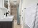Bathroom with a modern sink, stone-tiled shower, and spa-like atmosphere at 3445 N Clay St, Denver, CO 80211