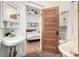 Bathroom featuring clawfoot tub and access to the bedroom at 3445 N Clay St, Denver, CO 80211