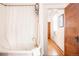 Bathroom featuring a vintage tub, updated hardware, and natural light at 3445 N Clay St, Denver, CO 80211