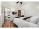 Bright bedroom with hardwood floors, white walls, and a ceiling fan at 3445 N Clay St, Denver, CO 80211
