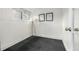 Minimalist room featuring dark carpet, white walls, and natural light from windows at 3445 N Clay St, Denver, CO 80211