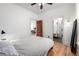 Cozy bedroom with hardwood floors and access to the ensuite bathroom at 3445 N Clay St, Denver, CO 80211