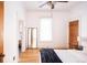 Spacious bedroom featuring hardwood floors, large windows, and ample natural light at 3445 N Clay St, Denver, CO 80211
