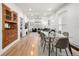 Open dining area with a glass table, hardwood floors, and built in cabinets at 3445 N Clay St, Denver, CO 80211