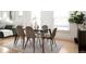 Bright dining area with modern table and chairs, hardwood floors, and large windows at 3445 N Clay St, Denver, CO 80211