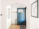 Stylish entryway featuring a blue door, wood floors, and modern decor for a welcoming first impression at 3445 N Clay St, Denver, CO 80211