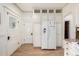 Well-appointed kitchen with ample cabinet space and a modern refrigerator at 3445 N Clay St, Denver, CO 80211