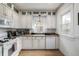 Classic kitchen featuring white cabinetry, granite countertops, and stainless steel appliances at 3445 N Clay St, Denver, CO 80211