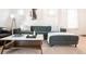 Cozy living room with a modern sectional, stylish coffee table, and hardwood floors at 3445 N Clay St, Denver, CO 80211