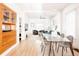 Spacious living room featuring a glass top dining table, modern seating, and ample natural light at 3445 N Clay St, Denver, CO 80211