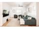Cozy living room boasts hardwood floors, lots of natural light, and comfortable seating for relaxation at 3445 N Clay St, Denver, CO 80211