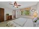 Relaxing bedroom with light-colored walls and a large sunlit window at 4525 S Cole Ct, Morrison, CO 80465