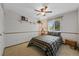 Comfortable bedroom featuring a ceiling fan and window with natural light at 4525 S Cole Ct, Morrison, CO 80465