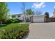 Beautiful two-story home featuring an attached two-car garage, landscaping, and inviting entrance at 4525 S Cole Ct, Morrison, CO 80465