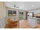 Eat-in kitchen with wood floors, stainless steel appliances, and sliding door to the backyard at 4525 S Cole Ct, Morrison, CO 80465