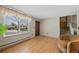 Welcoming living room with hardwood floors, natural light, and staircase access at 4525 S Cole Ct, Morrison, CO 80465