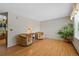 Bright living room featuring hardwood floors, large window, and comfortable seating at 4525 S Cole Ct, Morrison, CO 80465