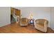Comfortable living room with hardwood floors, staircase, and neutral decor at 4525 S Cole Ct, Morrison, CO 80465