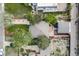 An aerial view showcases the home's backyard, roof, and surrounding landscaping with neighboring houses nearby at 1765 Xenia St, Denver, CO 80220