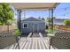 Backyard patio with string lights, comfortable seating and a view of the guest house at 1765 Xenia St, Denver, CO 80220