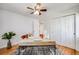 Bedroom with hardwood floors, a ceiling fan, a modern desk, and a large window at 1765 Xenia St, Denver, CO 80220