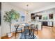 Cozy dining area with stylish table and chairs, adjacent to the kitchen at 1765 Xenia St, Denver, CO 80220