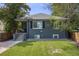 Charming home with a well-maintained lawn and inviting front porch at 1765 Xenia St, Denver, CO 80220