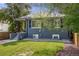 Charming home with a well-maintained lawn and inviting front porch at 1765 Xenia St, Denver, CO 80220